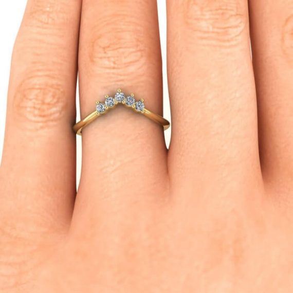 Curved Moissanite Diamond Wedding Band in Yellow Gold in hand