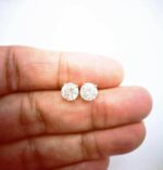1 Carat Diamond Solitaire Studs in Yellow Gold Hold By Fingers