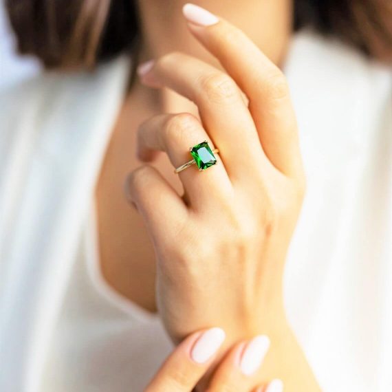 Green Emerald Cut Moissanite Engagement Ring - Women's Hand Showing Ring